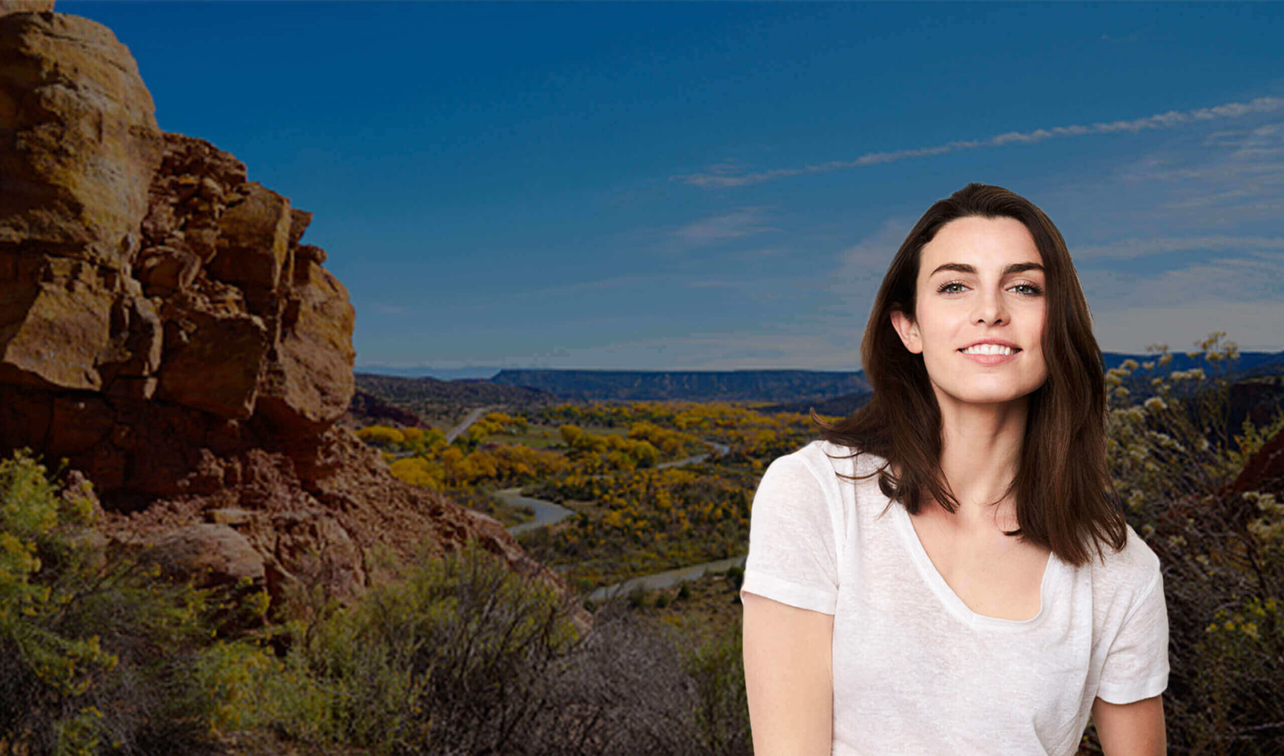 Woman in front of scenic backdrop