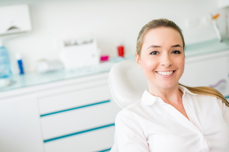 Young woman in the dental chair.
