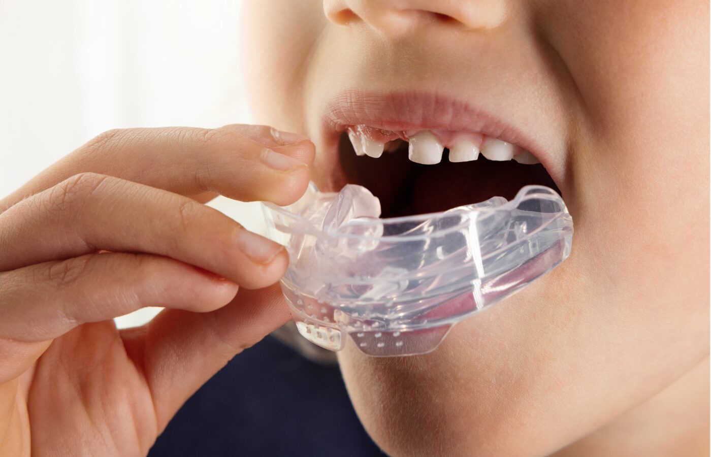 Child placing a MyoMunchee in their mouth